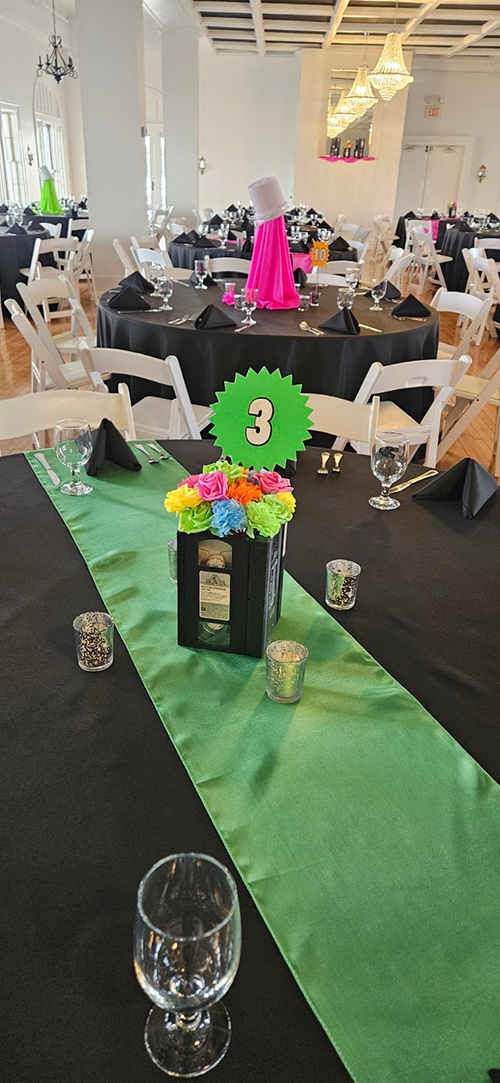 Bethesda Gala table with green tablecloth at hotel conneaut event venue